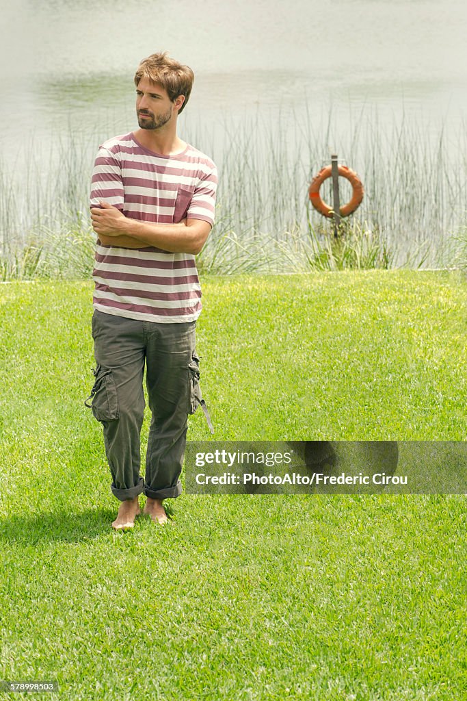 Man standing in front of lake