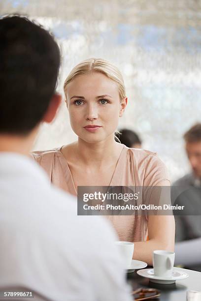 woman having coffee in cafe with man - blind date stock pictures, royalty-free photos & images