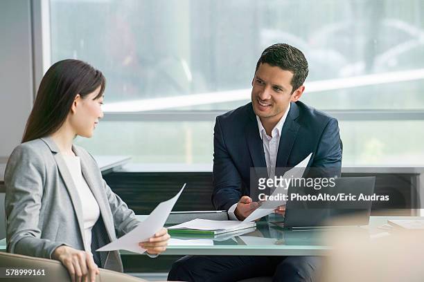 business associates reviewing document - suit and tie stock pictures, royalty-free photos & images