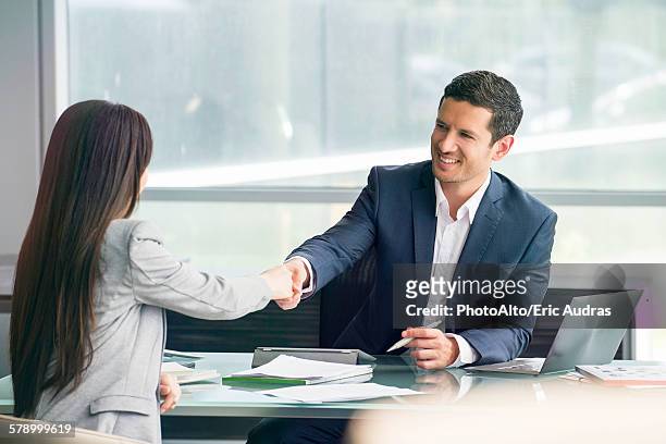 businessman shaking hands with client - lawyer computer stock pictures, royalty-free photos & images