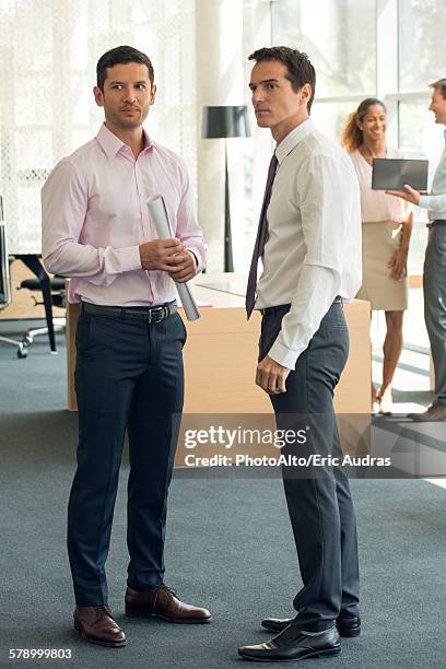 businessmen gossipping - sospetto foto e immagini stock