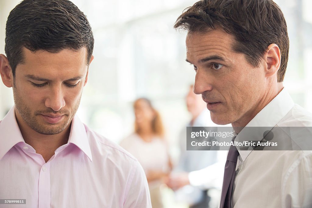 Executive having difficult talk with employee