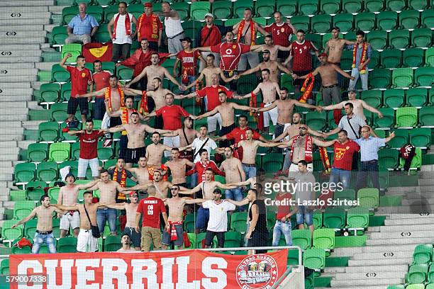 Supporters of FK Partizani are hand in hand during the UEFA Champions League Qualifying Round match between Ferencvarosi TC and FK Partizani at...