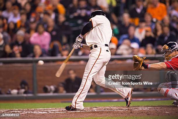 San Francisco Giants left fielder Juan Perez at bat and connecting with the ball, during the game between the San Francisco Giants and the Washington...
