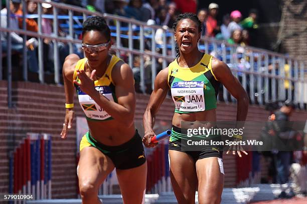 Jamaica's Natasha Morrison hands off to Anastasia Le-Roy during the USA vs. The World Women Sprint Medley competition at the Penn Relays at Franklin...