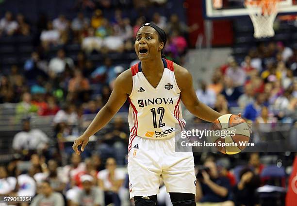 Ivory Latta of the Washington Mystics shouts instructions to her teammates against the Tulsa Shock during a WNBA game at Verizon Center, in...