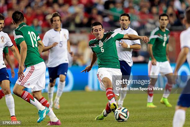 Mexico's Hector Herrera moves the ball through the mid field. The men's national team of Portugal defeated the men's national team of Mexico 1-0 in a...