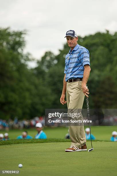 Tim Furyk reacts after missing his putt on the 18th hole during the final round of the 2014 RBC Canadian Open at the Royal Montreal Golf Club in Ile...