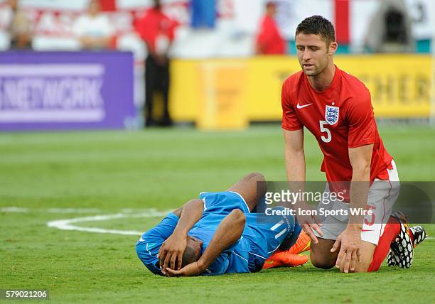 England Defender Gary Cahill watches Honduras Forward Jerry Bengtson hold his head on the pitch during an international friendly world cup warm up...