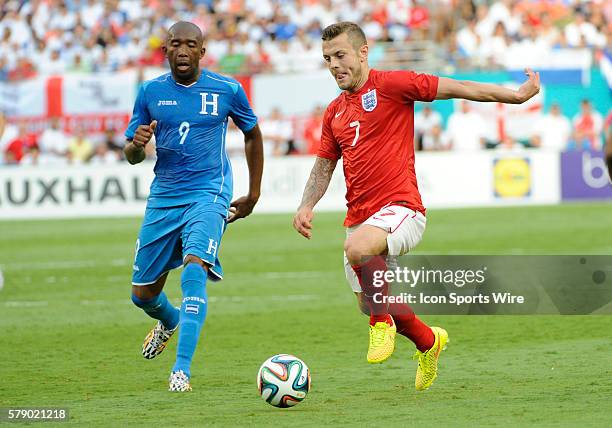 England Midfielder Jack Wilshere kicks the ball in front of Honduras Forward Jerry Palacios during an international friendly world cup warm up soccer...