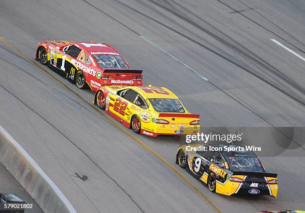 Jamie McMurray Earnhardt Ganassi Racing McDonald?s Chevrolet SS leads Joey Logano Penske Racing Shell/Pennzoil Ford Fusion and Marcos Ambrose Richard...