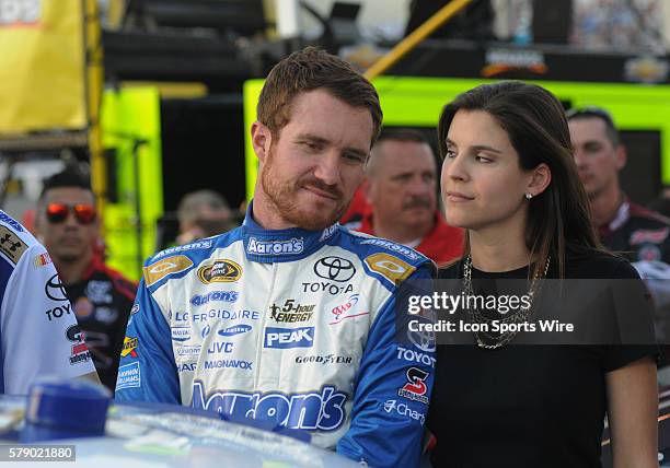 Brian Vickers Michael Waltrip Racing Aaron?s Dream Machine Toyota Camry with his wife before the Sprint Cup Series Toyota Owners 400. Joey Logano...