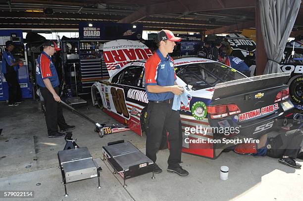 Crew members for Dale Earnhardt Jr. Hendrick Motorsports National Guard Chevrolet SS prepare the care for NASCAR Inspection before the Sprint Cup...