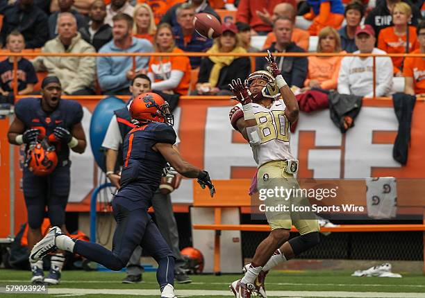 Florida State Seminoles wide receiver Rashad Greene makes a catch in front of Syracuse Orange cornerback Julian Whigham during ncaa football game...