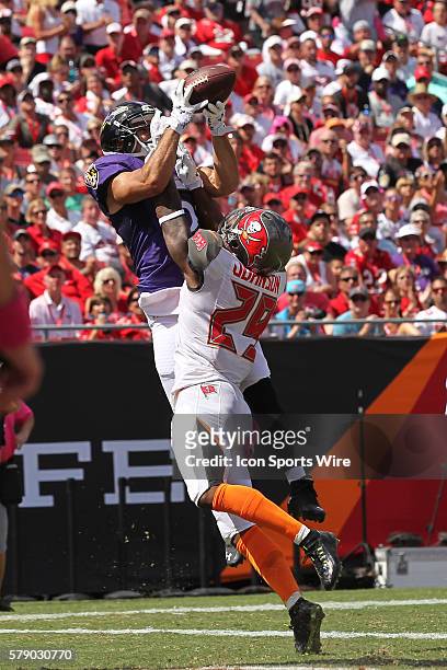 Baltimore Ravens wide receiver Michael Campanaro catches a pass over Tampa Bay Buccaneers cornerback Leonard Johnson in the end zone for a touchdown...