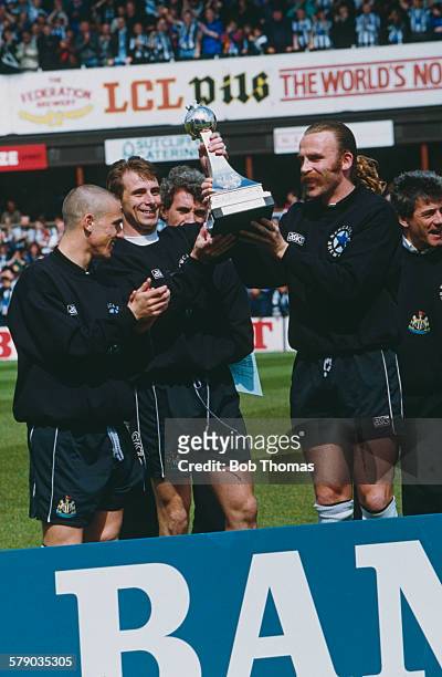 Newcastle United players Lee Clark, David Kelly and captain Brian Kilcline with the trophy after United beat Leicester City 7-1 to win the Football...