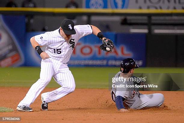 Detroit Tigers catcher Bryan Holaday safely steals second base ahead of the tag from Chicago White Sox second baseman Gordon Beckham in the eighth...