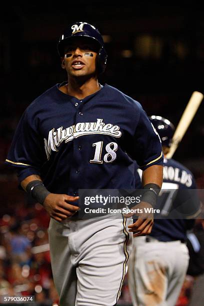 Milwaukee Brewers left fielder Khris Davis scores on a single by first baseman Lyle Overbay during the eleventh inning against the St. Louis...