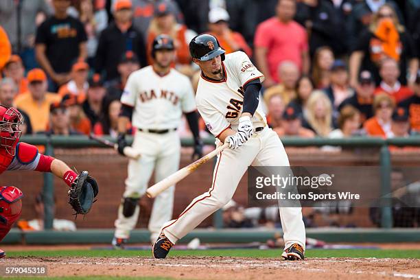 San Francisco Giants left fielder Juan Perez at bat for a single in the 10th inning, during game 3 of the National League Conference Series between...