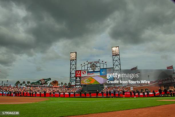 Giant flag is unfurled in the field, with a general view of the stadium, before game 3 of the National League Conference Series between the San...