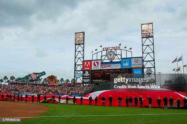 Giant flag is unfurled in the field, with a general view of the stadium, before game 3 of the National League Conference Series between the San...