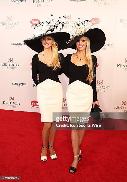 Tricia and Pricila Barnstable Brown arrive on the red carpet before the 140th running of the Kentucky Derby at Churchill Downs in Louisville, Ky.
