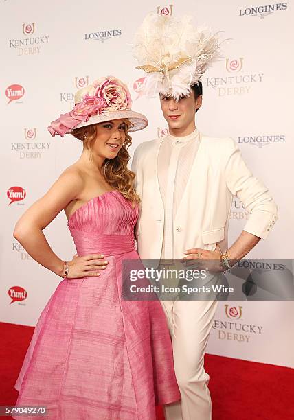 Former ice skaters Tara Lipinski and Johnny Weir arrive on the red carpet before the 140th running of the Kentucky Derby at Churchill Downs in...