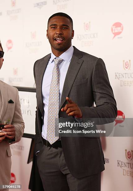 Buffalo Bills quarterback E.J. Manuel arrives on the red carpet before the 140th running of the Kentucky Derby at Churchill Downs in Louisville, Ky.