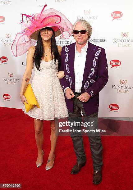 Mike Mills of the music group R.E.M. Arrives on the red carpet before the 140th running of the Kentucky Derby at Churchill Downs in Louisville, Ky.