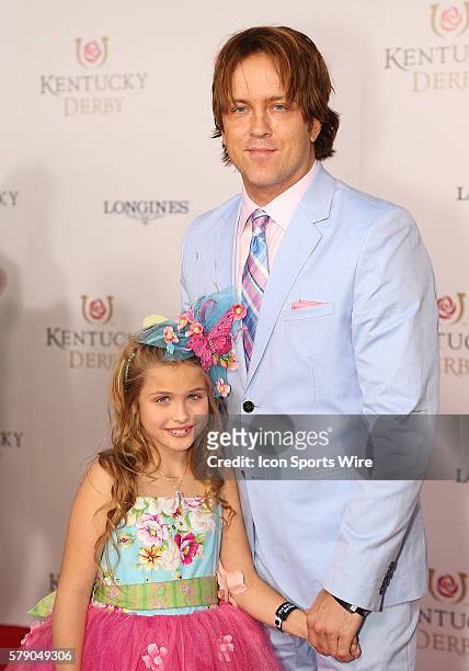 Larry Birkhead and his daughter, Dannielynn, arrive on the red carpet before the 140th running of the Kentucky Derby at Churchill Downs in...