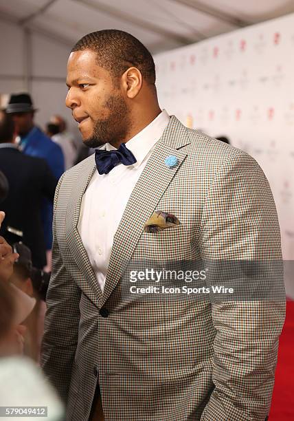 Detroit Lions star Ndamukong Suh arrives on the red carpet before the 140th running of the Kentucky Derby at Churchill Downs in Louisville, Ky.