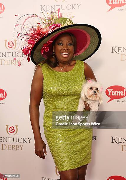 Star Jones and her dog, Pinky, arrive on the red carpet before the 140th running of the Kentucky Derby at Churchill Downs in Louisville, Ky.