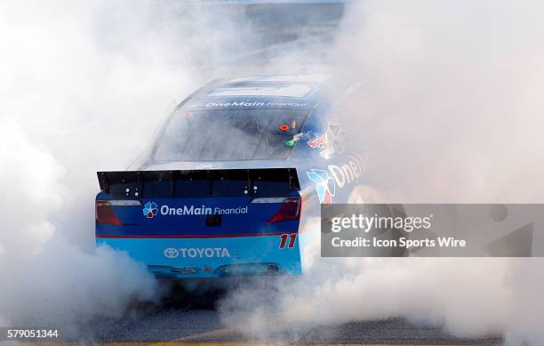 Elliott Sadler celebrates after winning the Aaron's 312 NASCAR Nationwide Series race at the Talladega Super Speedway in Talladega, AL.