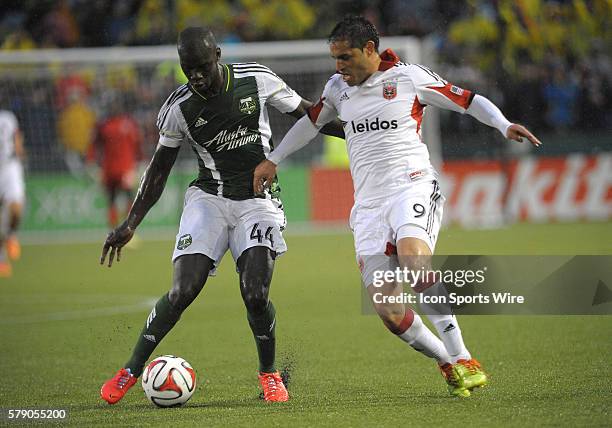 May 03, 2014 - Portland Timbers D Pa Modou Kah controls the ball while defended by DC United F Fabian Espinoza during a Major League Soccer game...
