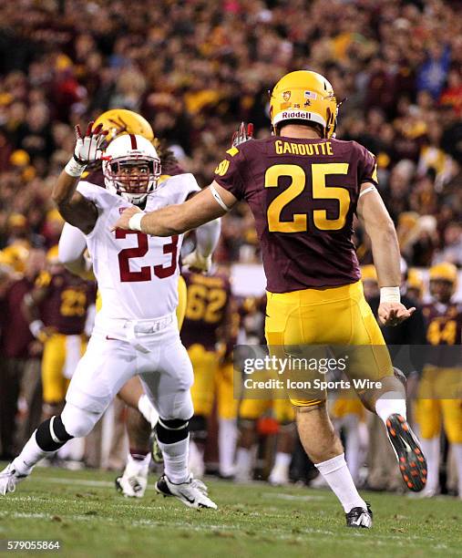 Arizona State's Alex Garoutte punts over Stanford's Jackson Cummings during the Arizona State vs Stanford Pac-12 Championship college football game...