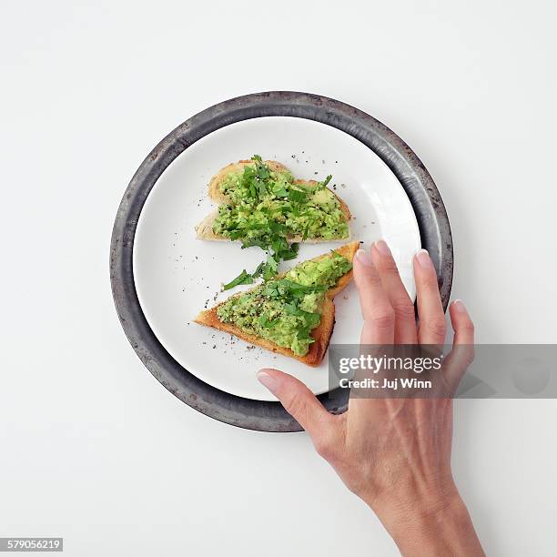 avocado on toast - avocado toast stock pictures, royalty-free photos & images