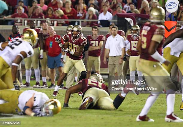 Florida State's Rashad Greene catches a pass from quarterback Jameis Winston in the game between the Notre Dame Fighting Irish and the Florida State...