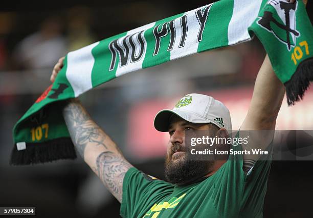 June 11, 2014 - A member of the Timbers Army shows his support during a Major League Soccer game between the Portland Timbers and FC Dallas at...