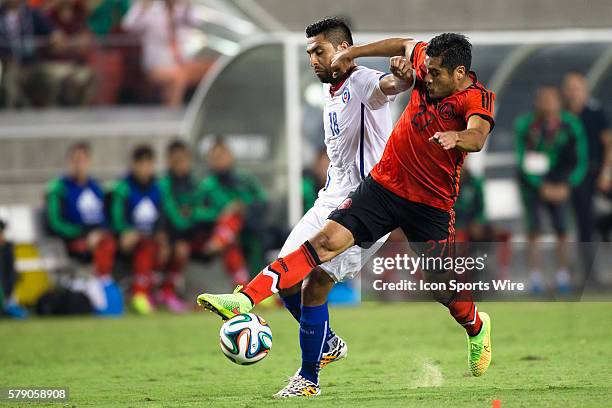 Mexico forward Javier Antonio Orozco and Chile defender Gonzalo Jara battle for possession, during the game between Mexico and Chile at Levi's...