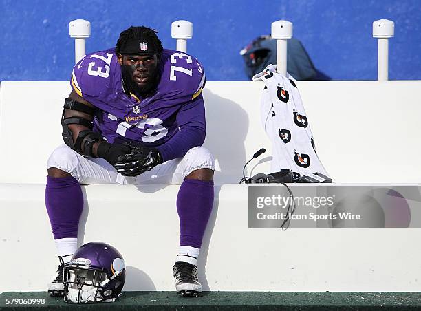 Minnesota Vikings defensive tackle Sharrif Floyd sit on the Minnesota Vikings bench dejected after losing a NFL game between the Minnesota Vikings...