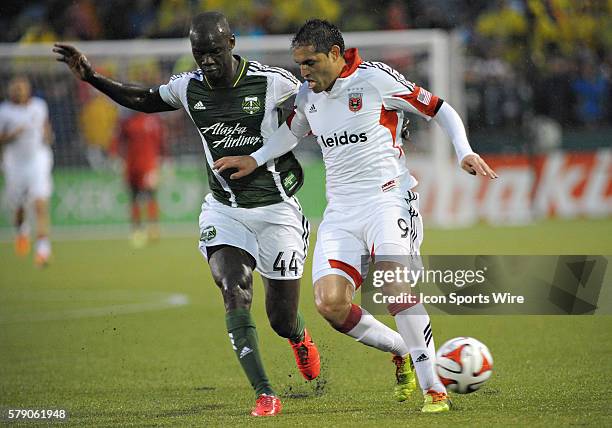 May 03, 2014 - Portland Timbers D Pa Modou Kah battles DC United F Fabian Espinoza for the ball during a Major League Soccer game between the...
