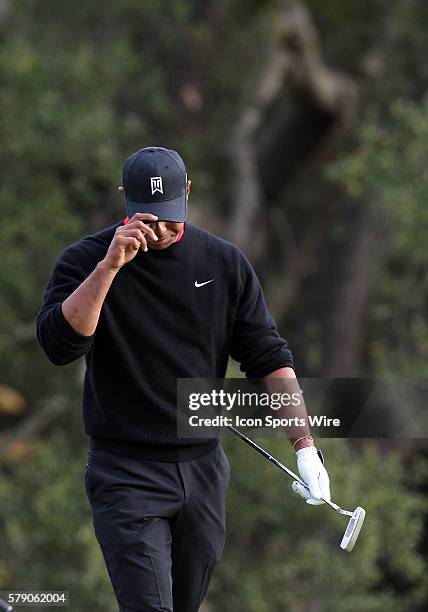Tiger Woods reacts after a shot during the final round of the Northwestern Mutual World Challenge at Sherwood Country Club in Thousand Oaks, CA.
