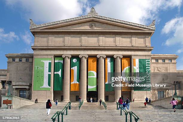 View showing the Field Museum's south façade with visitors walking up the stairs and the museum's spring banners.