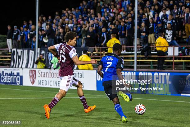 San Jose Earthquakes midfielder Cordell Cato battles to get a cross past Colorado Rapids defender Chris Klute during the game between the San Jose...