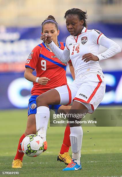 Carolina Venegas of Costa Rica moves up on Karyn Forbes of Trinidad & Tobago during a CONCACAF Women's World Cup semi-final qualifier at PPL Park, in...