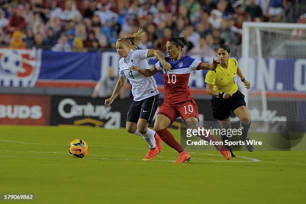 Tampa, Florida, USA, Eugenie Le Sommer of France and Carli Lloyd of the USA battle in front of the ref during USA v France friendly International...
