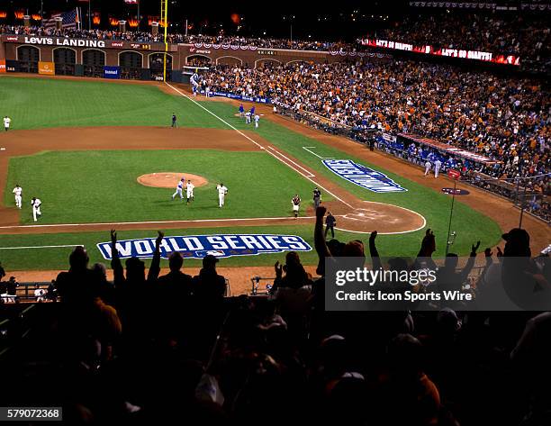 Fans cheer as the San Francisco Giants end the top of the 8th inning, during game three of the World Series between the San Francisco Giants and the...