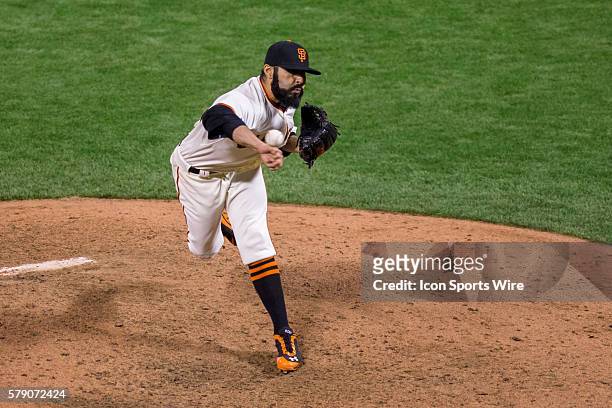 San Francisco Giants relief pitcher Sergio Romo pitching in the 7th inning, during game three of the World Series between the San Francisco Giants...