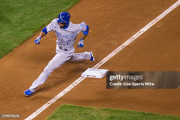 Kansas City Royals shortstop Alcides Escobar rounds third base on his way home to score on a 2-run double by Gordon (not shown, in the 6th inning...