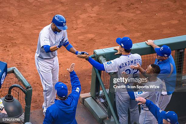 Kansas City Royals shortstop Alcides Escobar celebrates scoring off a ground out by Kansas City Royals center fielder Lorenzo Cain , in the first...